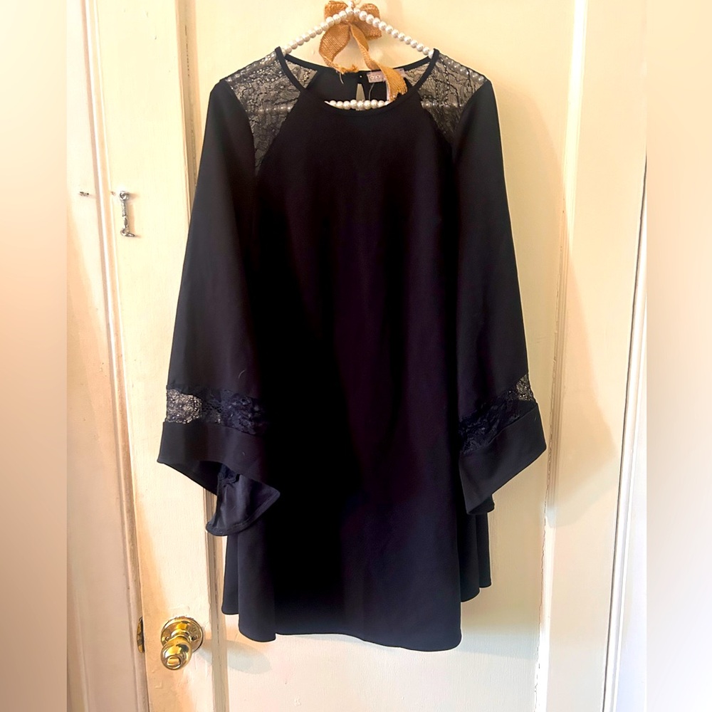 Black bell sleeve dress with lace on sleeves . Size 4